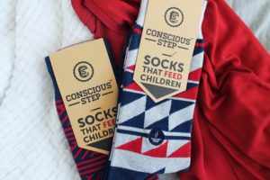 Socks That Give Back Two Pairs of Socks on a Red and White Cloth