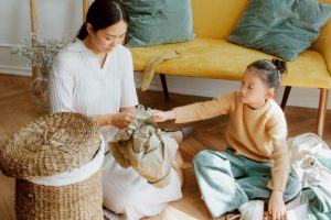 Good Deeds for Kids Mom and Daughter Sorting Through Clothes